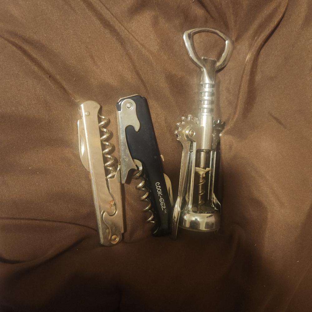 * 3 wine bottle openers and a budweiser bottle opener